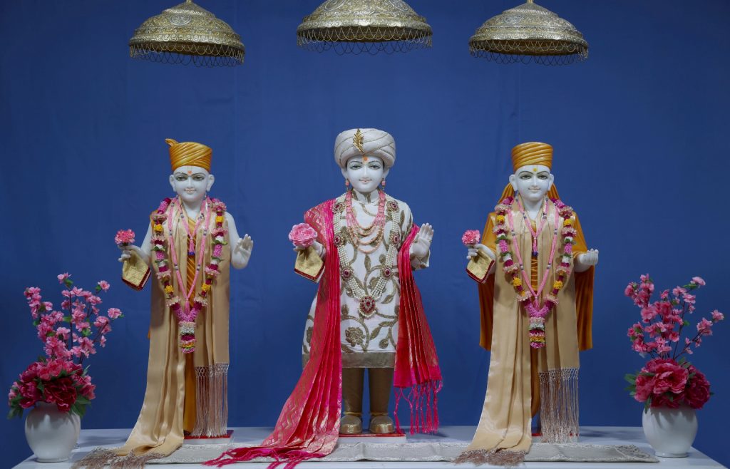 In Centre, Poorna Purushottam Shree Sahajanand Swami Maharaj, On Left Anadi Mul Akshar Murti Shree Gunatitanand Swami and On Right Anadi Mahamukta Shree Gopalanand Swami