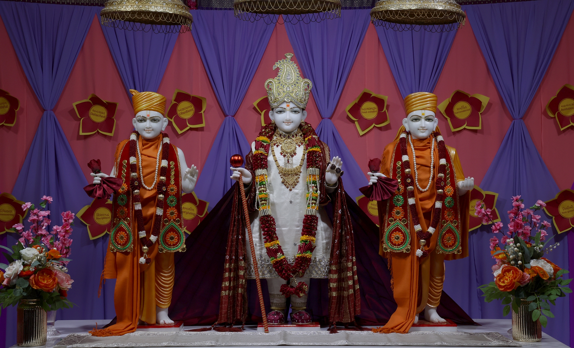In Centre, Poorna Purushottam Shree Sahajanand Swami Maharaj, On Left Anadi Mul Akshar Murti Shree Gunatitanand Swami and On Right Anadi Mahamukta Shree Gopalanand Swami