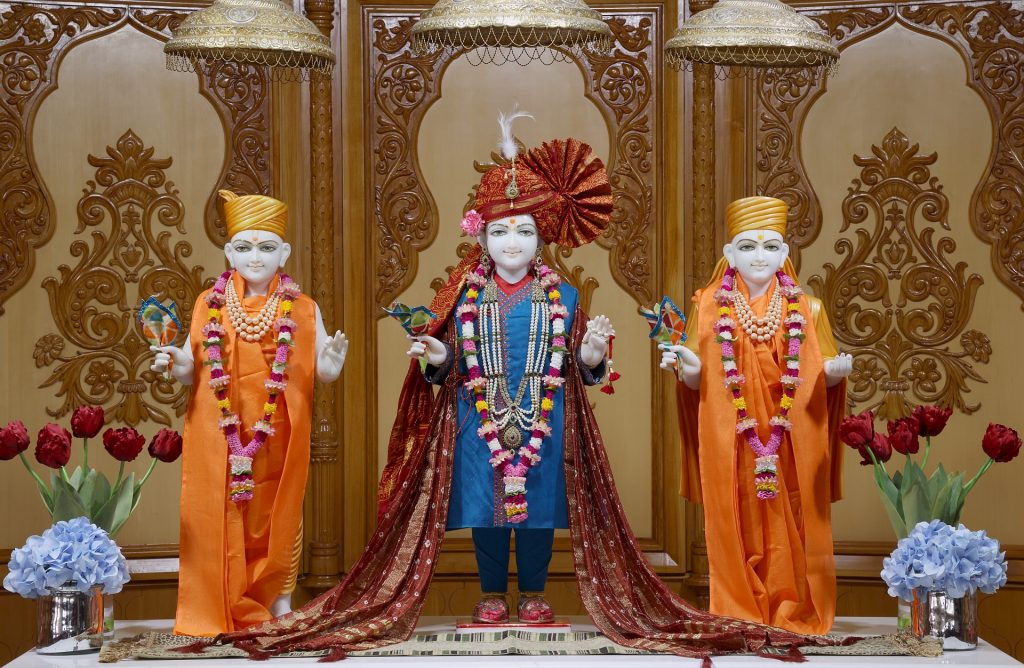 In Centre, Poorna Purushottam Shree Sahajanand Swami Maharaj, On Left Anadi Mul Akshar Murti Shree Gunatitanand Swami and On Right Anadi Mahamukta Shree Gopalanand Swami