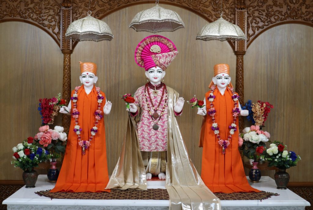 In Centre, Poorna Purushottam Shree Sahajanand Swami Maharaj, On Left Anadi Mul Akshar Murti Shree Gunatitanand Swami and On Right Anadi Mahamukta Shree Gopalanand Swami