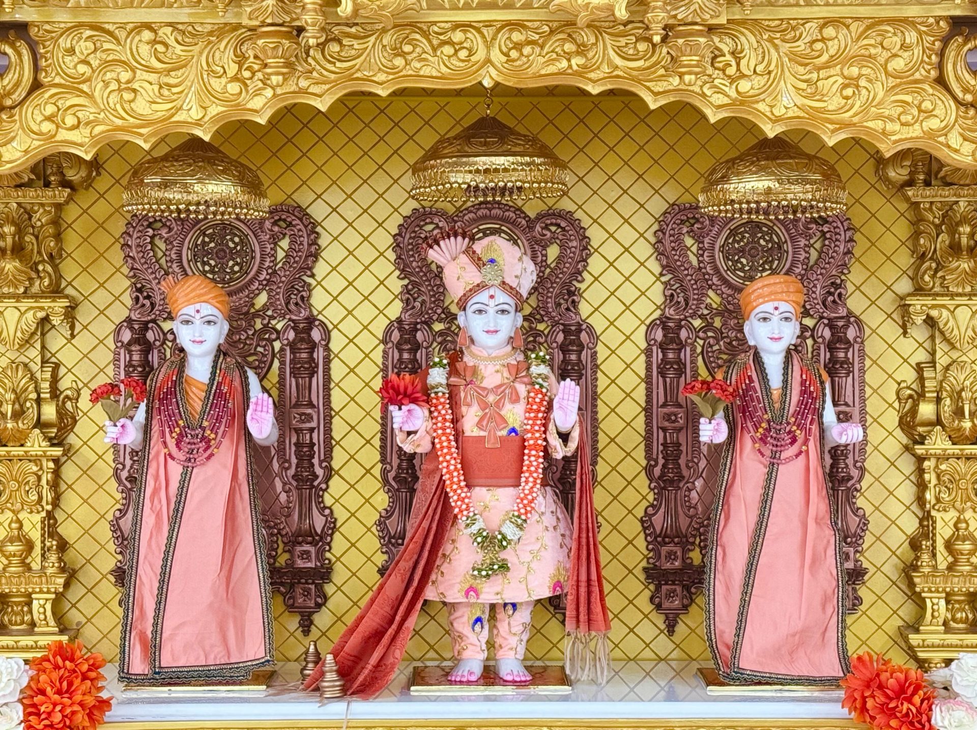 In Centre, Poorna Purushottam Shree Sahajanand Swami Maharaj, On Left Anadi Mul Akshar Murti Shree Gunatitanand Swami and On Right Anadi Mahamukta Shree Gopalanand Swami
