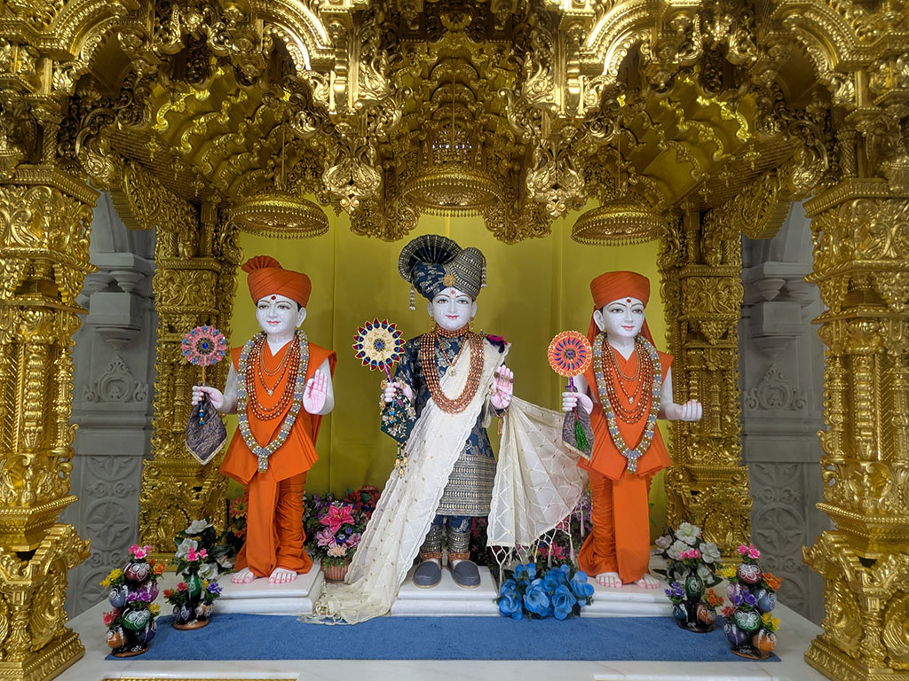 In Centre, Poorna Purushottam Shree Sahajanand Swami Maharaj, On Left Anadi Mul Akshar Murti Shree Gunatitanand Swami and On Right Anadi Mahamukta Shree Gopalanand Swami