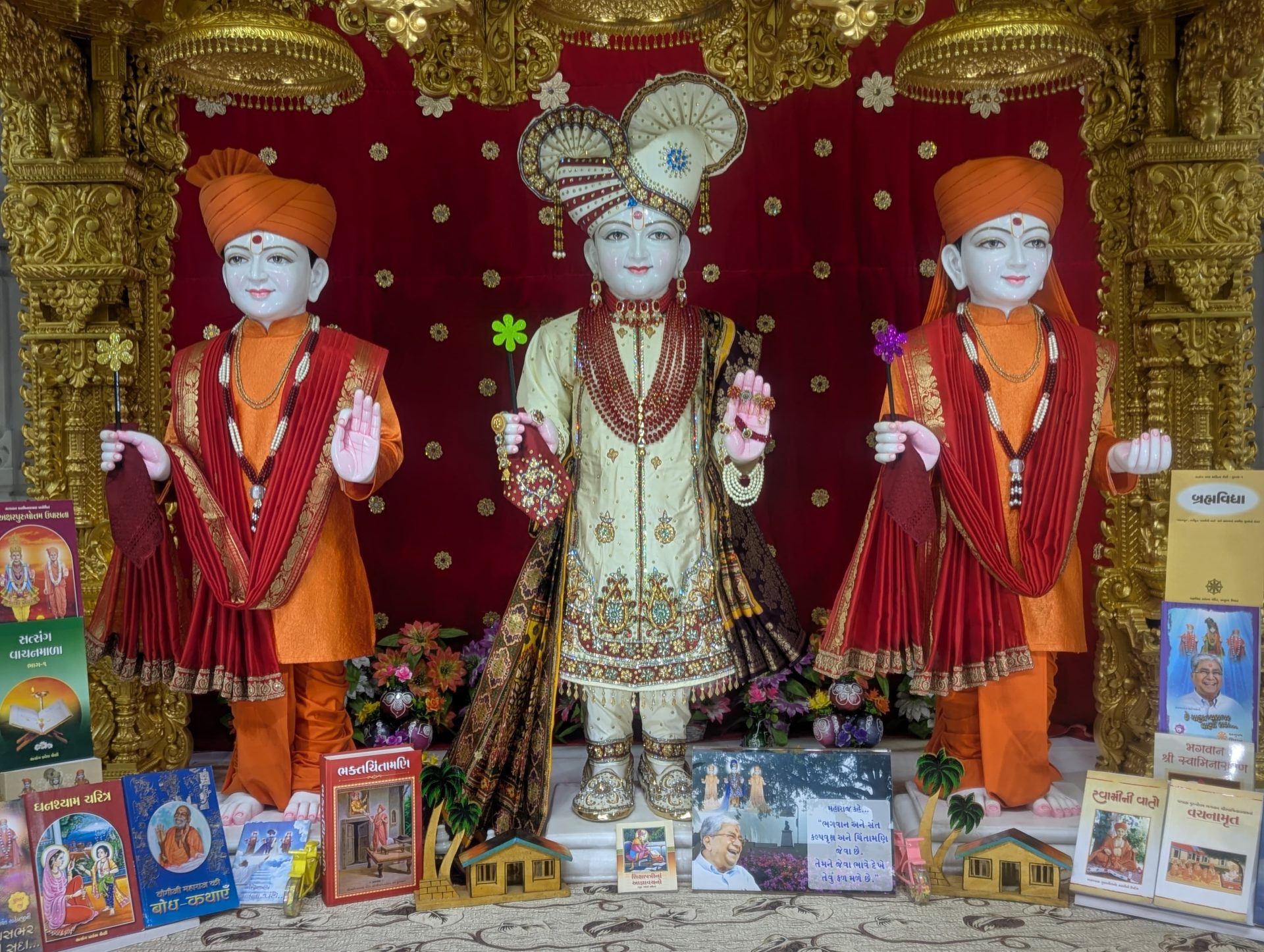 In Centre, Poorna Purushottam Shree Sahajanand Swami Maharaj, On Left Anadi Mul Akshar Murti Shree Gunatitanand Swami and On Right Anadi Mahamukta Shree Gopalanand Swami