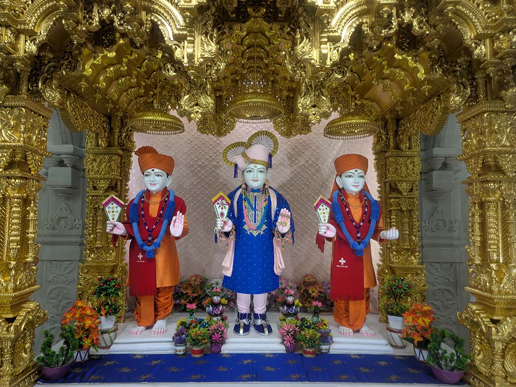 In Centre, Poorna Purushottam Shree Sahajanand Swami Maharaj, On Left Anadi Mul Akshar Murti Shree Gunatitanand Swami and On Right Anadi Mahamukta Shree Gopalanand Swami