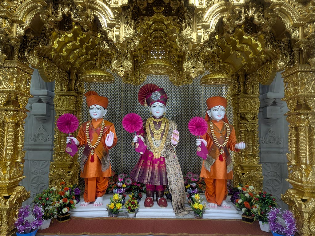 In Centre, Poorna Purushottam Shree Sahajanand Swami Maharaj, On Left Anadi Mul Akshar Murti Shree Gunatitanand Swami and On Right Anadi Mahamukta Shree Gopalanand Swami