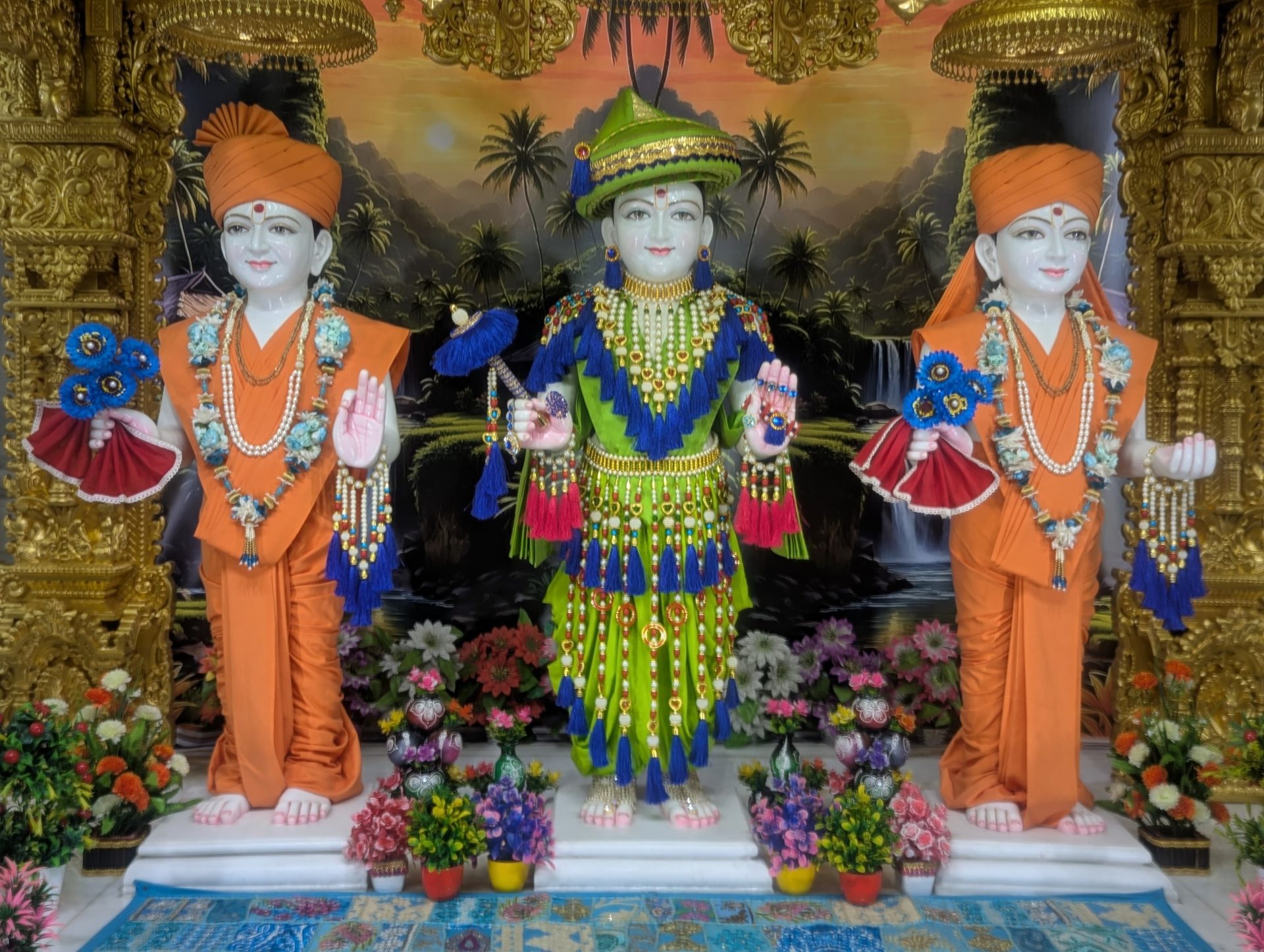 In Centre, Poorna Purushottam Shree Sahajanand Swami Maharaj, On Left Anadi Mul Akshar Murti Shree Gunatitanand Swami and On Right Anadi Mahamukta Shree Gopalanand Swami
